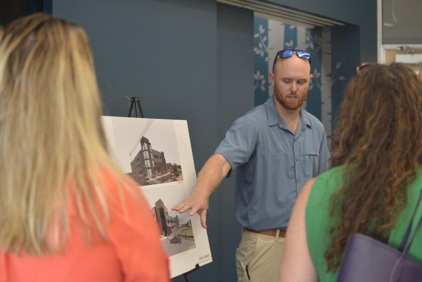 Development Associate for Confluence Companies Tucker Bennet walks residents through the current rendering of the PACE parking garage.